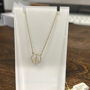 Gold and faux-diamond peace sign necklace